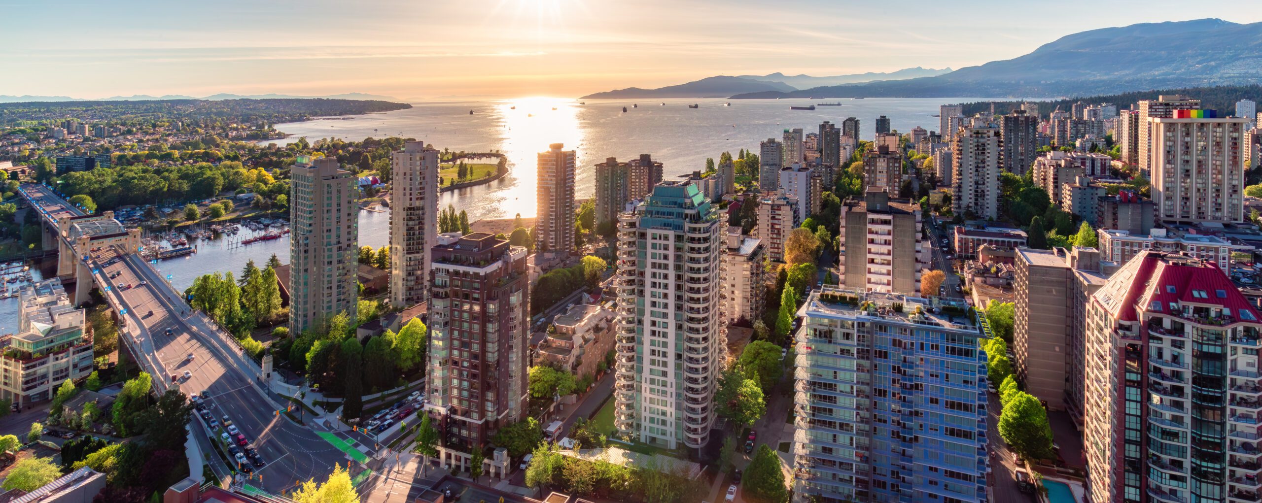 Where to Stay in Vancouver - Downtown Vancouver Cityscape on West Coast of Pacific Ocean. Sunset. Aerial Panorama
